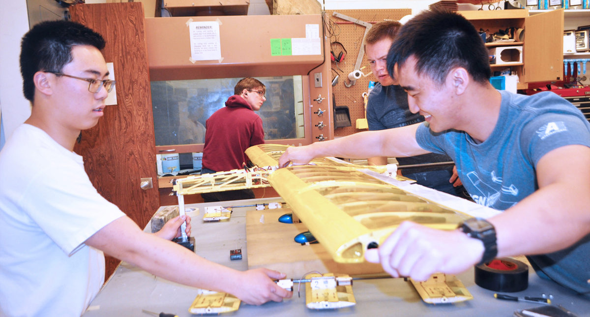 Tristian, Scott, and Eddie work on Buzzformer (UAV)