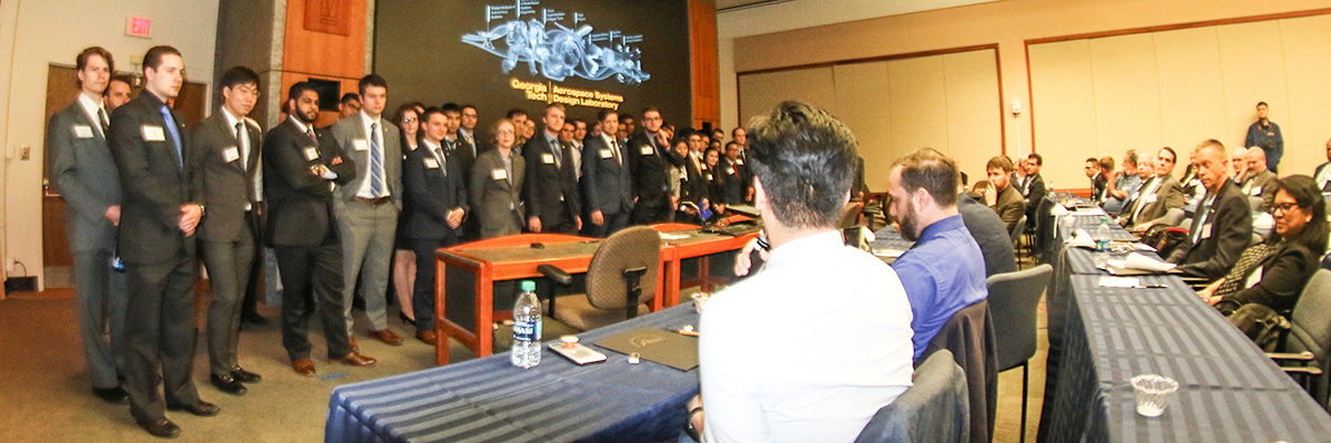 Students listening to critques from sponsors at the EAB