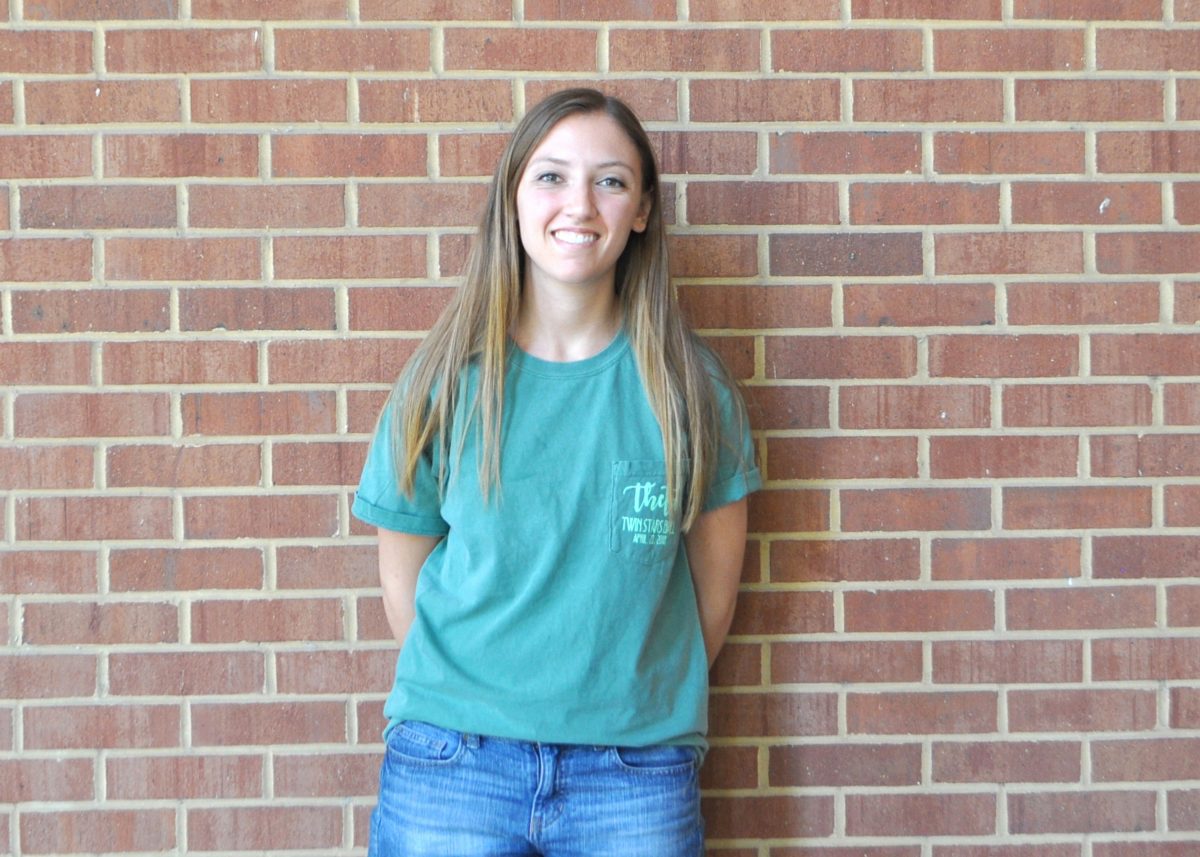 Emily Glover posing in front of the Weber building