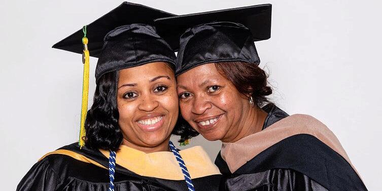 Sadie Marshall and her daughter LaShonya in their cap and gowns